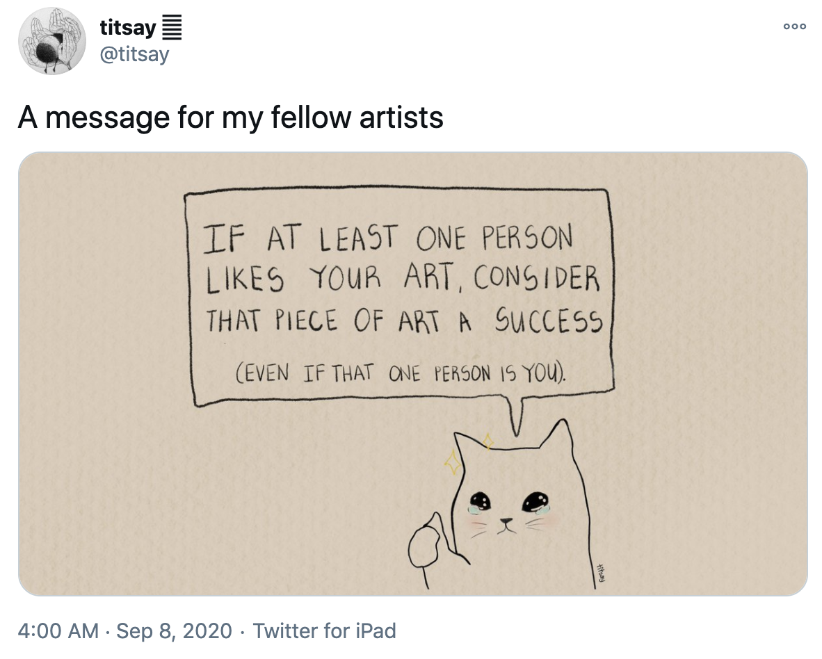 A tweet that shows a message for "fellow artists." A cat with tears in its eyes gives a thumbs up and says, "If at least one person likes your art, consider that piece of art a success. (Even if that one person is you.)"