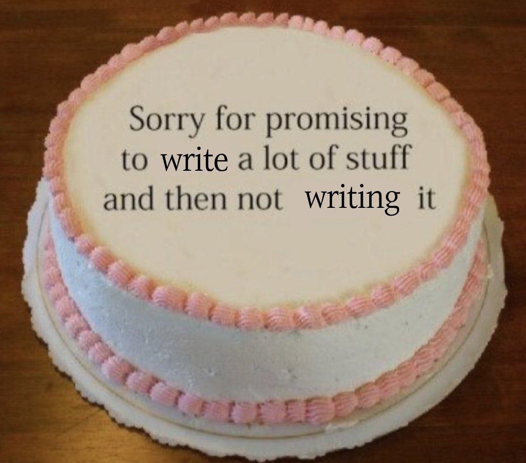 A white cake with pink frosting that says "Sorry for promising to write a lot of stuff and then not writing it."